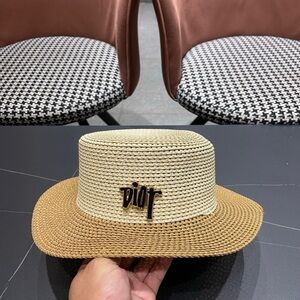 Dior beige and light brown straw hat featuring the brand logo